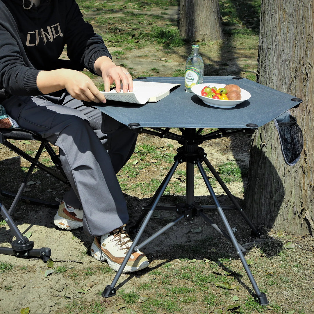 Table de camping pivotante portable à hauteur réglable (64/93 cm), table de pique-nique pliable pour la plage, le jardin et les voyages, tissu imperméable 600D et cadre en métal, sac de rangement inclus.