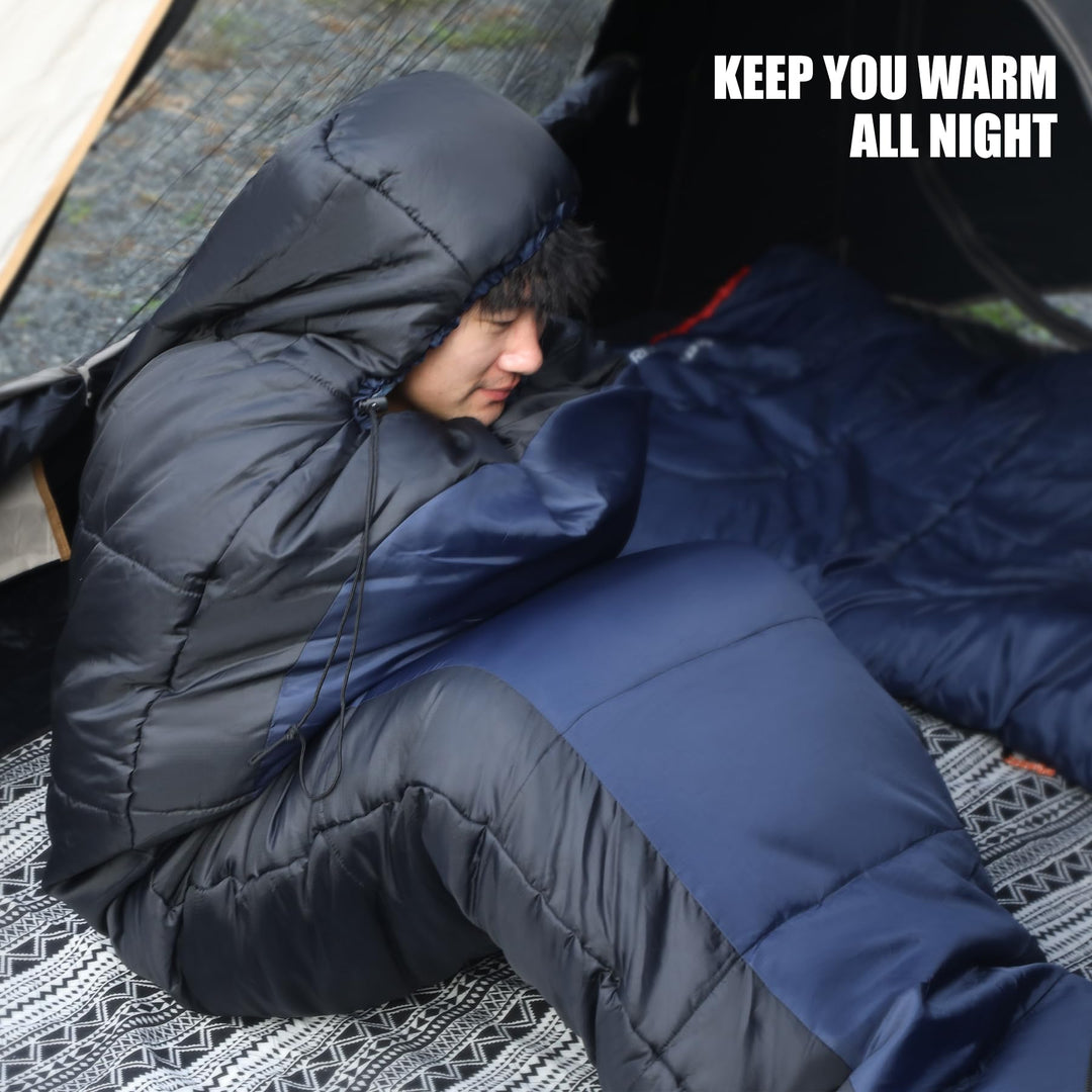 Person resting in a hooded navy mummy sleeping bag inside a tent